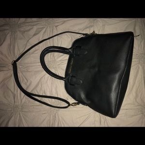 Christian Siriano black short/arm purse.